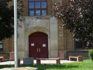 The entry still bears the inscription "Henry A. Chaney School." Photo source: waymarking.com.